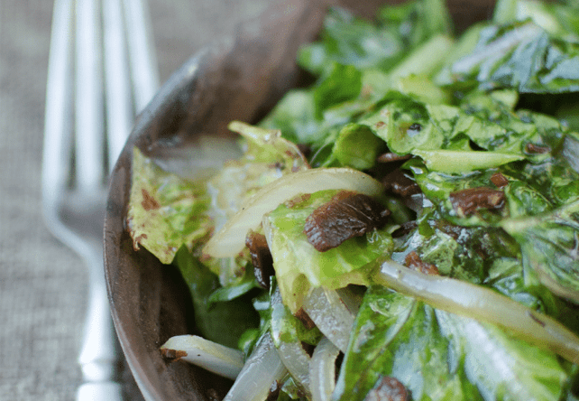 green salad in wood bowl close up