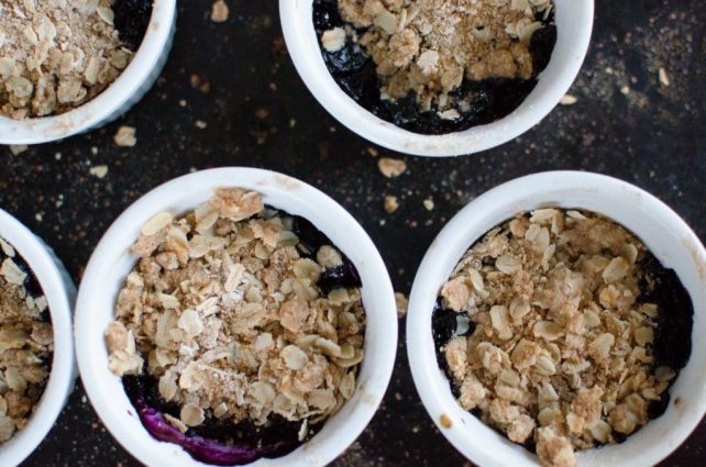Sweet & tart Fresh Blueberry Crisp with homemade streusel topping is so delicious served warm with a scoop of vanilla ice cream! And it's so simple to prepare, even the kids can make it!