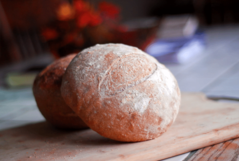 Round loaf of bread on a cutting board