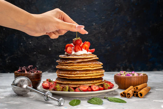 pancakes with syrup and fruits