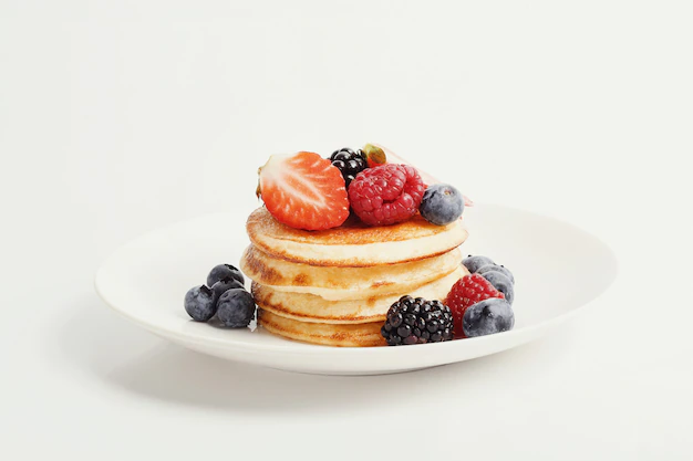 pancakes with syrup and fruits