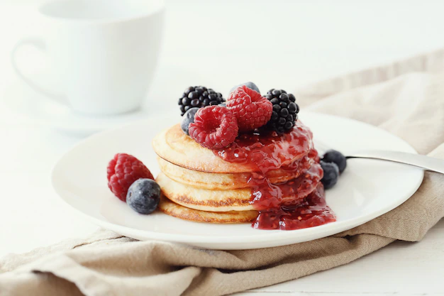 pancakes with syrup and fruits