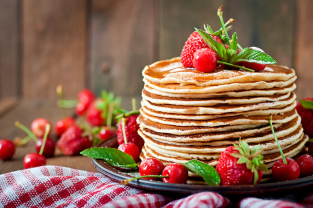pancakes with syrup and fruits