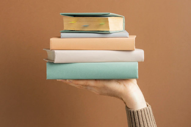 Books hold by hand