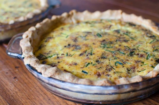 Farm Fresh Quiche Lorraine made with eggs, cream, bacon, onions, and herbs in a shortbread crust. Rich and hearty and utterly delicious!