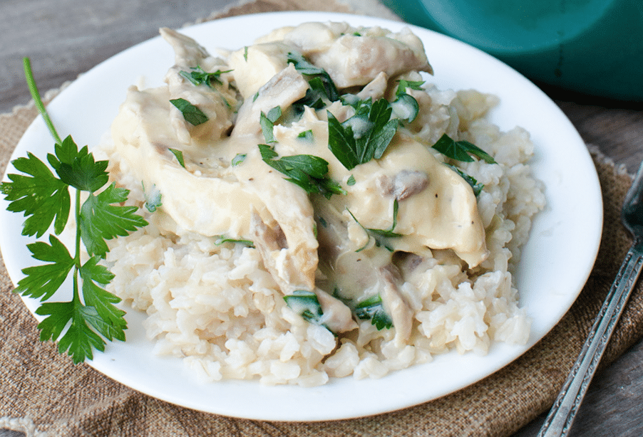 Old Hen in Parsley Sauce on white plate