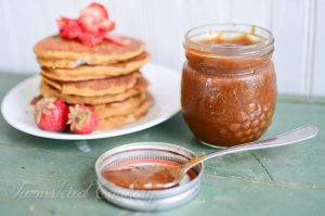 Rhubarb-Butter-in jar next to stack of pancakes