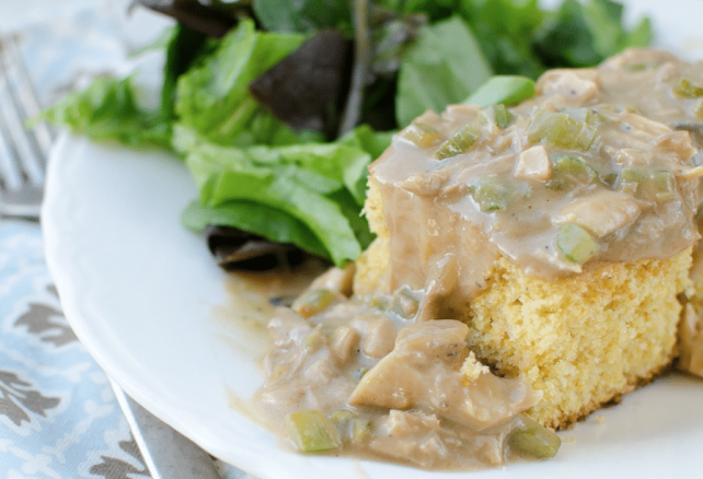 Creamed Chicken over Cornbread on a white plate