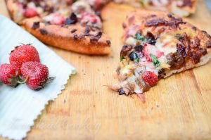 Sweet-Smoky-Strawberry-Balsamic-Pizza-slice on wooden board