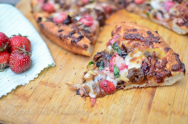 This sweet & smoky strawberry pizza features beautiful, bright red strawberries, a sprinkling of bacon as well as caramelized onions, so you know it's got to be good!