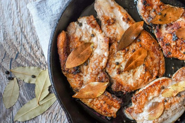 porks chops frying in pan