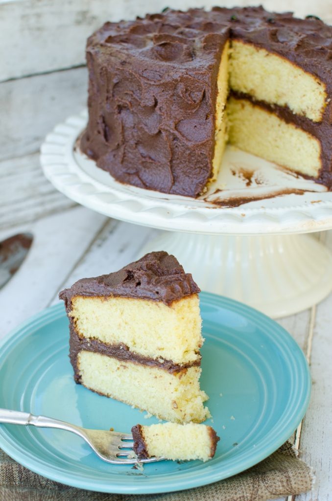 yellow cake with chocolate mascarpone-3 piece on blue plate