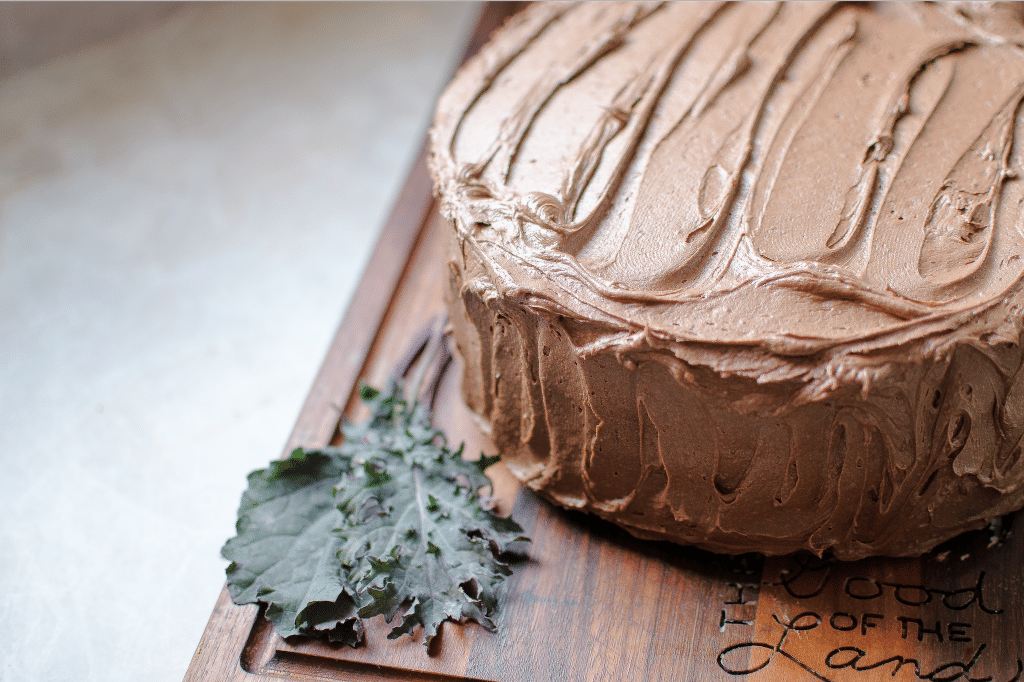 chocolate cake whole on cutting board I'm gonna let you in on my little secret to get a moist chocolate cake recipe using a special, stealth-veggie ingredient.... kale! Chocolate Kale Cake is not your everyday, run of the mill chocolate cake, my friends!