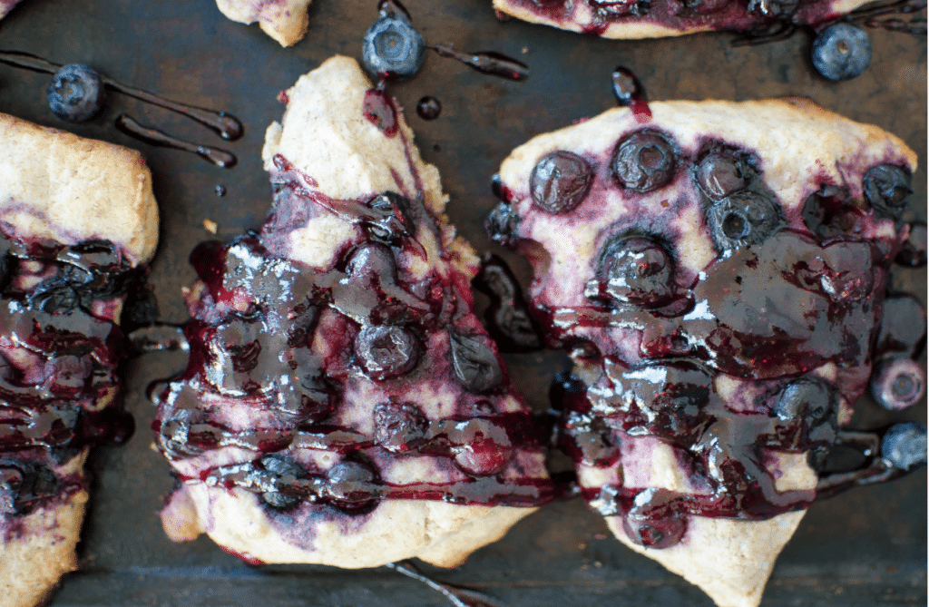 blueberry sauce on pie shaped pieces