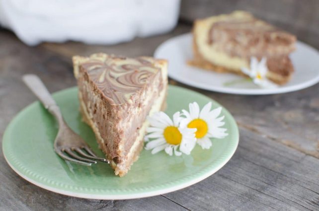 This Creamy Chocolate Swirl cheesecake with layers of chocolate and vanilla swirled to make a beautiful marbled appearance is the best cheesecake ever! 