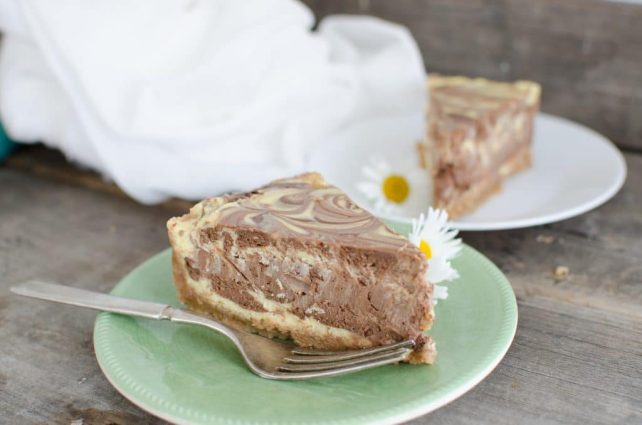 This Creamy Chocolate Swirl cheesecake with layers of chocolate and vanilla swirled to make a beautiful marbled appearance is the best cheesecake ever! 