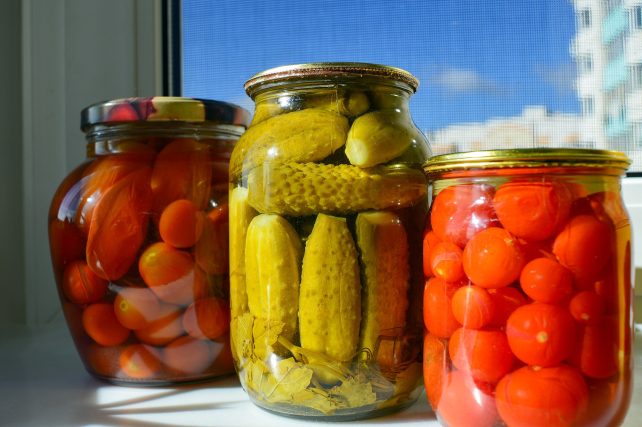 Three jars full of various easy canning recipes