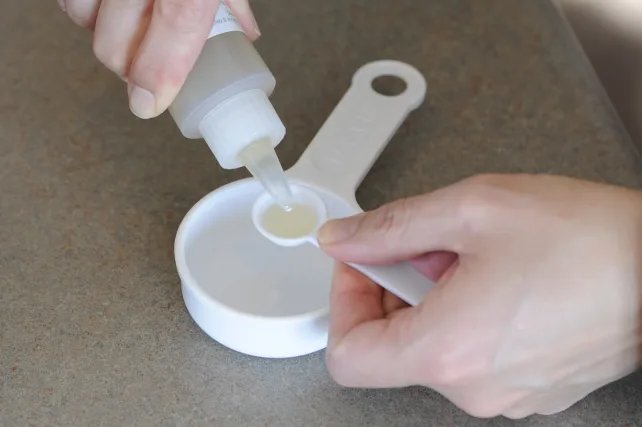 dissolving rennet in water to make cheese