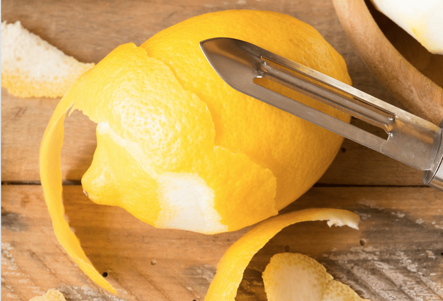 lemon being peeled on table