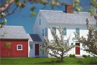 big white house and red shed in the yard1
