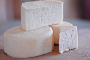 Farmhouse Cheddar Cheese in a stack
