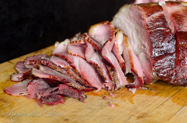 sliced ham on a wooden cutting board 2