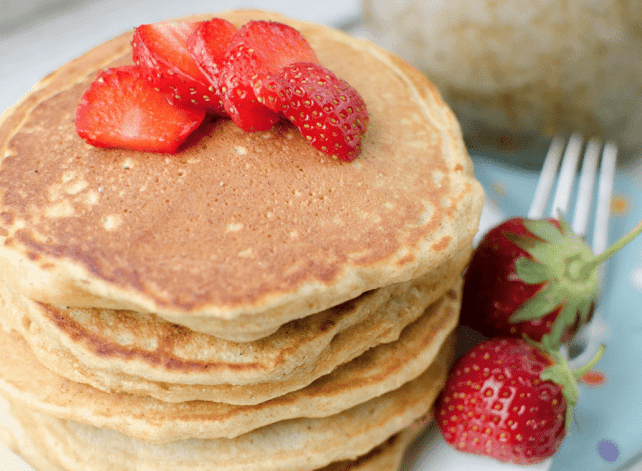 buttermilk pancakes with strawberries on them