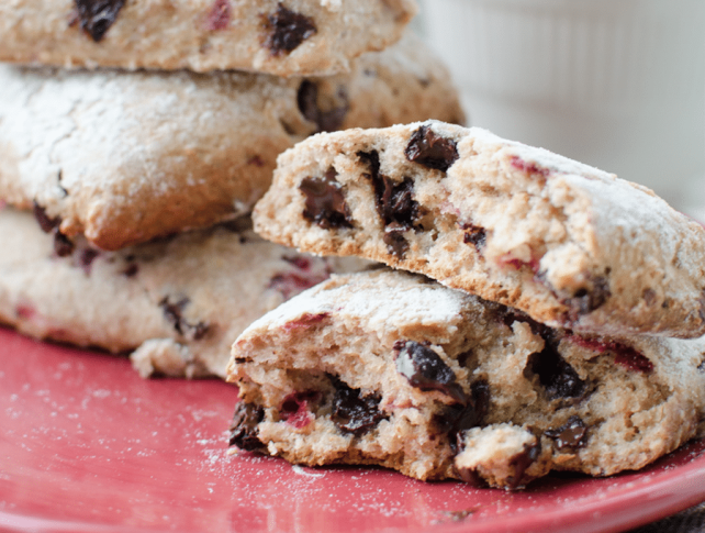 Whole Wheat Chocolate Chip & Strawberry Scones on red plate close up