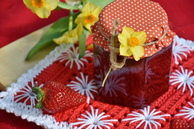 A jar of strawberry jam, which is one of our easy canning recipes