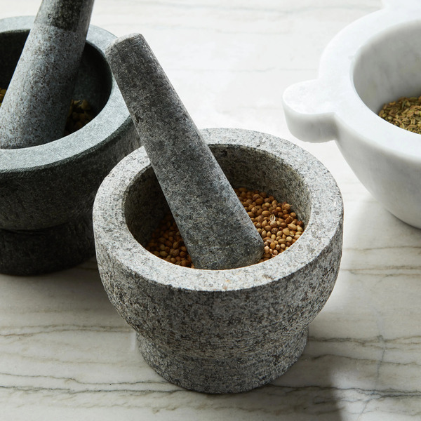 three marble mortar and pestle